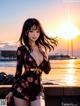 A woman in a floral dress standing on a pier at sunset.